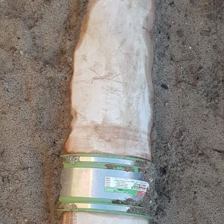 Chemical resistant pipe coupling for contaminated ground applications